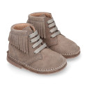 Suede leather ankle desert boots style with fringed design.