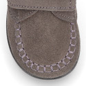 Suede leather Kids loafer shoes with hook and loop strap closure.