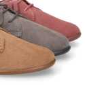 Kids Oxford shoes with fringes design and laces closure in suede leather.