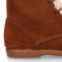 Kids suede leather little bootie with fake hair pipe design.