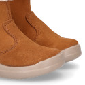 Kids suede leather boots with fur neck design in tan color.