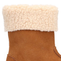 Kids suede leather boots with fur neck design in tan color.