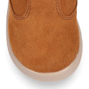 Kids suede leather boots with fur neck design in tan color.