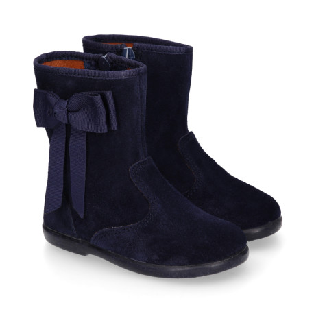 Deep blue suede leather girl boots with ribbon design.