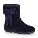 Deep blue suede leather girl boots with ribbon design.