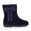 Deep blue suede leather girl boots with ribbon design.