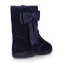 Deep blue suede leather girl boots with ribbon design.