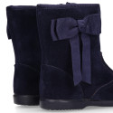 Deep blue suede leather girl boots with ribbon design.