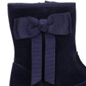 Deep blue suede leather girl boots with ribbon design.