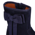 Deep blue suede leather girl boots with ribbon design.