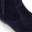 Deep blue suede leather girl boots with ribbon design.