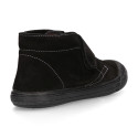 Suede leather ankle boot shoes laceless and with toe cap.