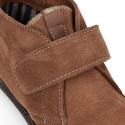 Suede leather ankle boot shoes laceless and with toe cap.