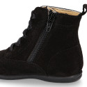 Girl Pascuala style boots with side zipper closure and laces in suede leather.