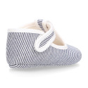 Cotton canvas T-strap shoes for babies with stripes print design.