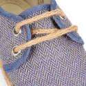 Cotton canvas laces up shoes esparile style with spike design.