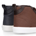 Combined leather with canvas ankle boots tennis style with shoelaces.