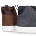 Combined leather with canvas ankle boots tennis style with shoelaces.