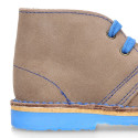 Suede safari boots with contrast stitching, laces and Outsole.