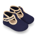 Classic cotton canvas T-Strap shoes for babies with hook and loop strap.