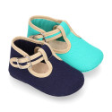 Classic cotton canvas T-Strap shoes for babies with hook and loop strap.