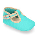 Classic cotton canvas T-Strap shoes for babies with hook and loop strap.