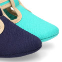 Classic cotton canvas T-Strap shoes for babies with hook and loop strap.