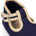 Classic cotton canvas T-Strap shoes for babies with hook and loop strap.