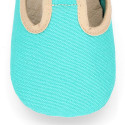 Classic cotton canvas T-Strap shoes for babies with hook and loop strap.