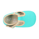 Classic cotton canvas T-Strap shoes for babies with hook and loop strap.