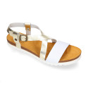 Metal leather sandal shoes for toddler girls with white soles.