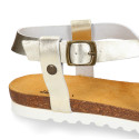 Metal leather sandal shoes for toddler girls with white soles.