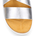 Metal leather sandal shoes for toddler girls with white soles.