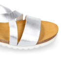 Metal leather sandal shoes for toddler girls with white soles.