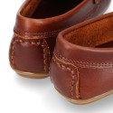 Classic tanned leather kids loafer shoes with detail mask.