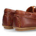 Classic tanned leather kids loafer shoes with laces design.