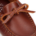 Classic tanned leather kids loafer shoes with laces design.