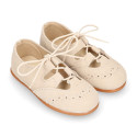 English style kids shoes with shoelaces in suede leather in pastel colors.