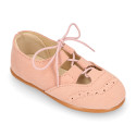 English style kids shoes with shoelaces in suede leather in pastel colors.