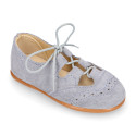 English style kids shoes with shoelaces in suede leather in pastel colors.