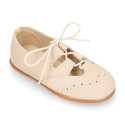 English style kids shoes with shoelaces in suede leather in pastel colors.