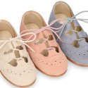 English style kids shoes with shoelaces in suede leather in pastel colors.