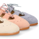 English style kids shoes with shoelaces in suede leather in pastel colors.