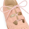 English style kids shoes with shoelaces in suede leather in pastel colors.