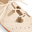 English style kids shoes with shoelaces in suede leather in pastel colors.