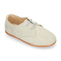 Oxford style kids shoes with shoelaces in suede leather in pastel colors.