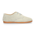 Oxford style kids shoes with shoelaces in suede leather in pastel colors.