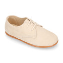 Oxford style kids shoes with shoelaces in suede leather in pastel colors.