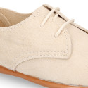 Oxford style kids shoes with shoelaces in suede leather in pastel colors.