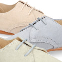 Oxford style kids shoes with shoelaces in suede leather in pastel colors.